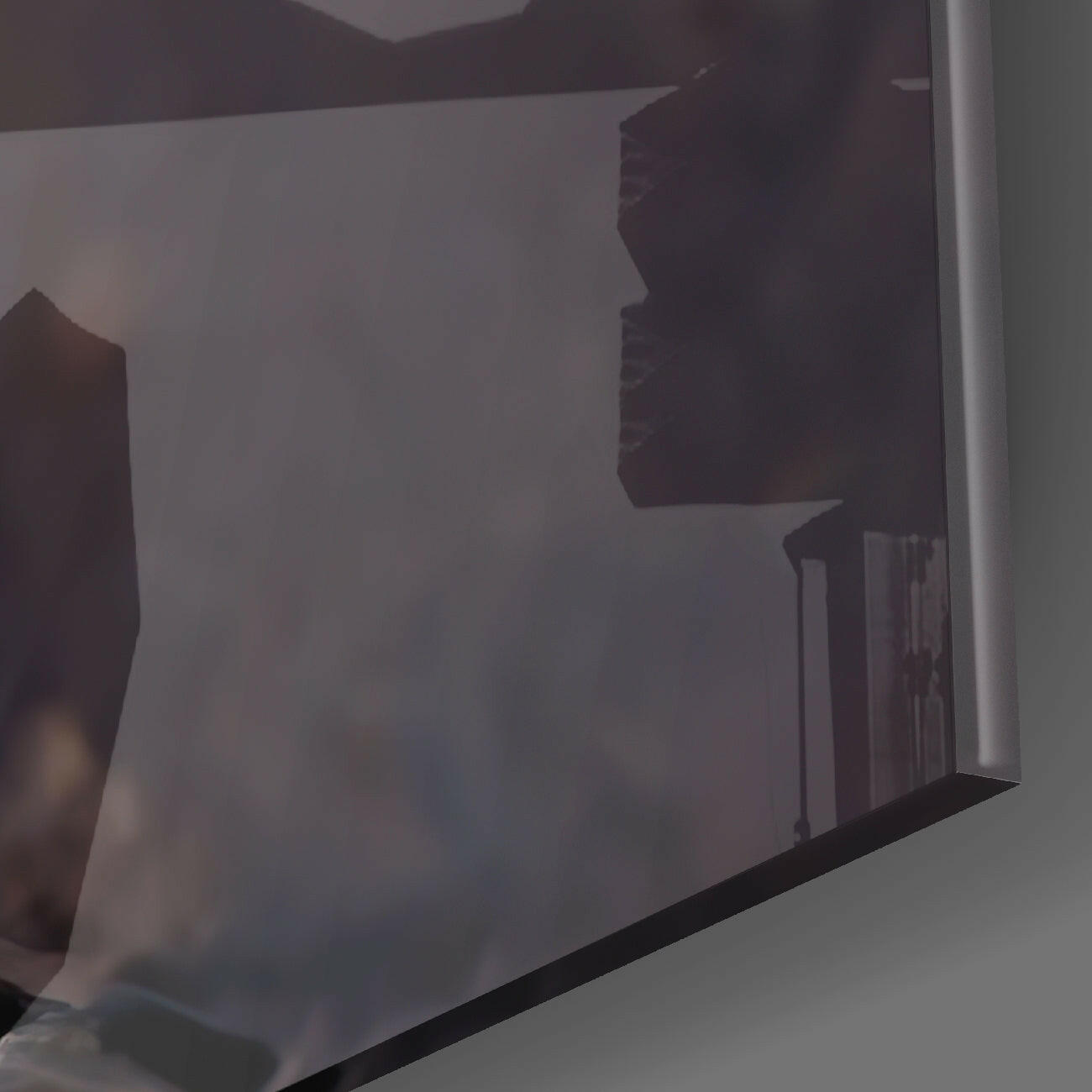Close-up angled view of translucent frosted glass panel showing dark silhouette design with black border edge.
