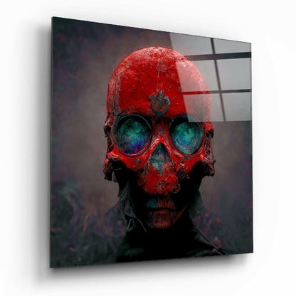 Red skull with turquoise eye sockets mounted on glass panel, displayed at angle against white background.