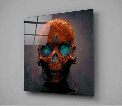 Orange and teal skull head glass wall art mounted on gray wall, displayed at angle with grid pattern visible on surface.