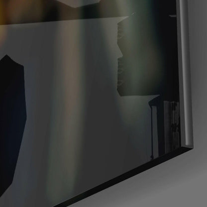 Frosted glass panel with silhouetted profile of a beak pointing right, mounted at an angle against white wall.