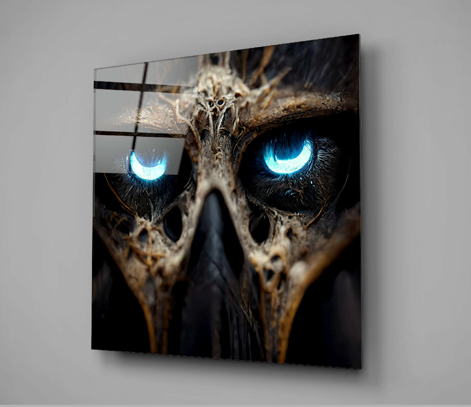 Close-up of owl face with piercing bright blue eyes and textured brown feathers behind black grid lines on glass panel.