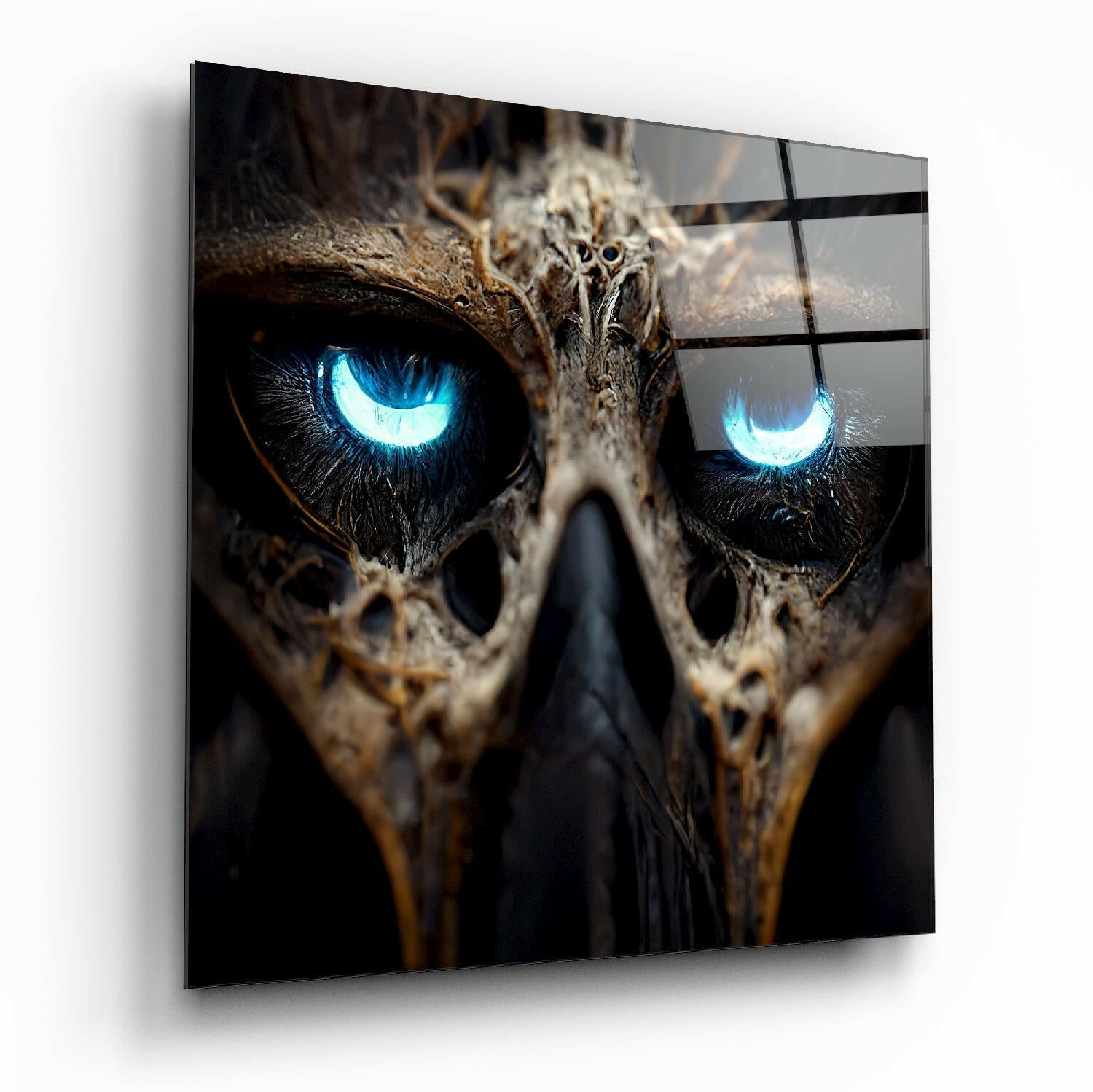 Close-up angled view of glass wall art featuring an owl's face with striking bright blue glowing eyes against dark plumage and textured background.