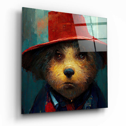 A dog wearing a red hat and blue jacket against a teal and red abstract background on a glass wall panel, angled to show depth and shadow.