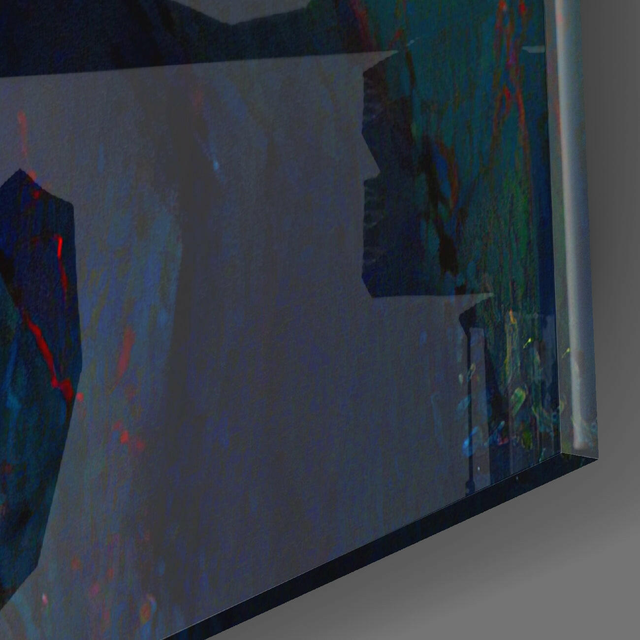 Angled side view of glass wall art panel displaying abstract blue, green, red, and teal colors with textured surface against white wall.
