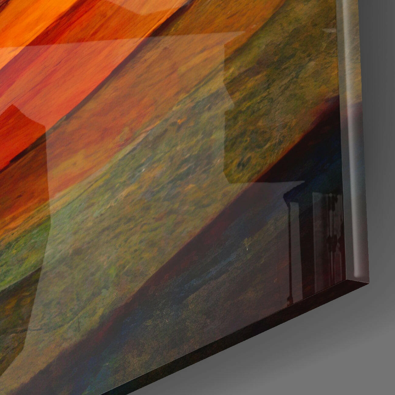 Close-up angled view of Flow Glass Wall Art showing layered diagonal wood grain texture with warm orange, red, and green tones against gray wall background.
