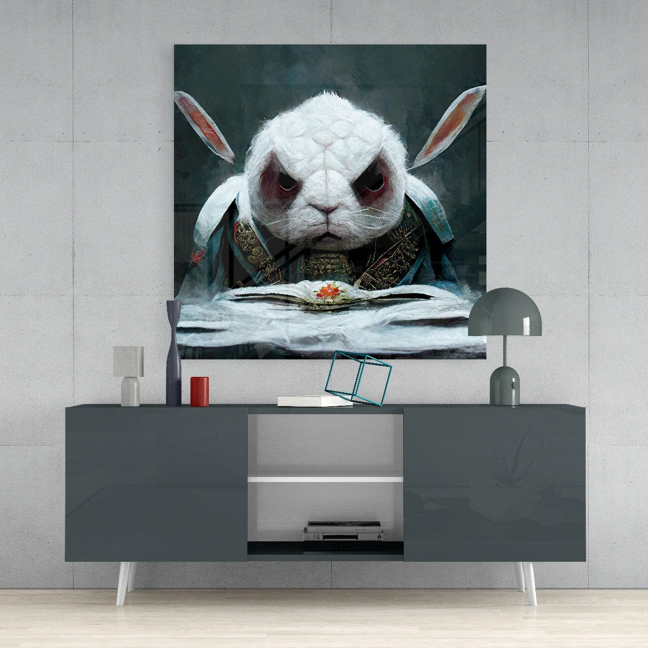 White rabbit with crimson eyes wearing ornate armor sits at desk reading, displayed above gray media console in modern interior.