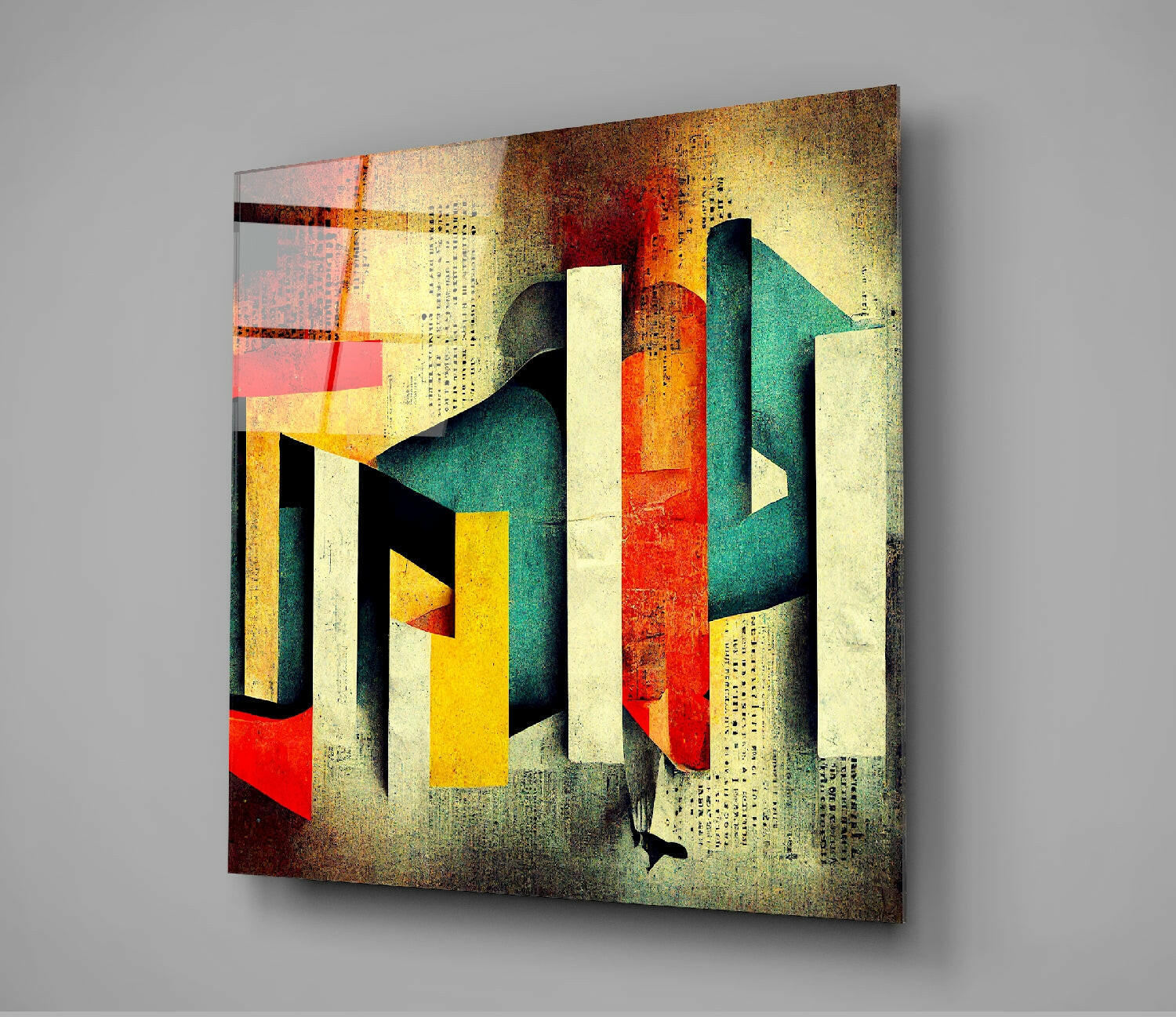 Modern glass wall art displaying geometric alphabet letters in red, yellow, teal, and cream on a textured golden-brown background, angled perspective view.