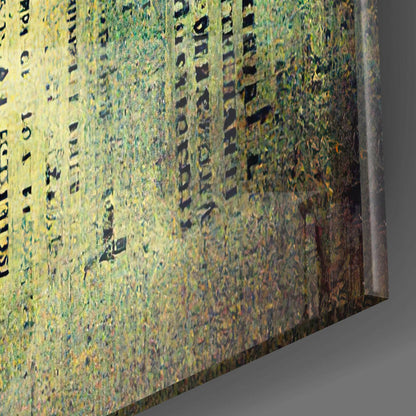 Close-up angled view of textured glass surface with scattered black letters and yellow-green coloring.