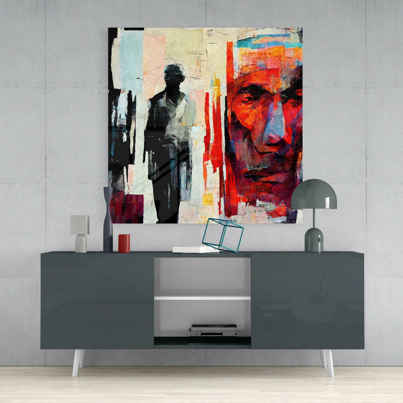 Modern living room display with abstract mixed-media wall art featuring red, orange, and monochrome tones above gray media console.