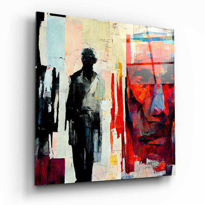 Abstract glass wall art featuring a silhouetted figure against layered geometric shapes in red, cream, black, and blue tones.