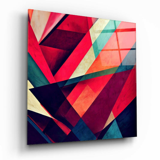 Angled perspective view of a glass wall art panel displaying overlapping geometric triangles in red, teal, navy, cream, and orange with dimensional shadow effects.