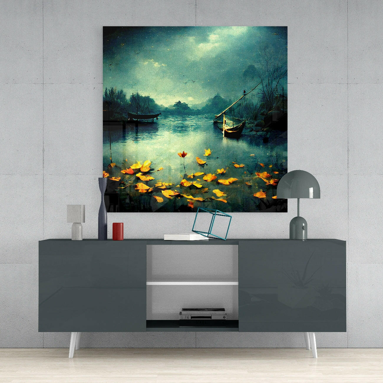 Glass wall art panel mounted above gray media console showing moonlit river scene with boats and golden flowers in foreground.