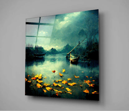Glass wall art panel displaying a moody teal waterscape with golden autumn leaves floating on water and wooden boats.