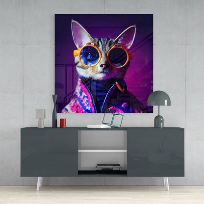 Vibrant neon pop art glass panel featuring a cat wearing oversized orange goggles against purple background, displayed above modern gray console table.