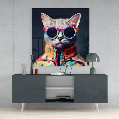Vibrant pop art canvas of a cat wearing colorful round sunglasses and patterned sweater displayed above a gray media console.