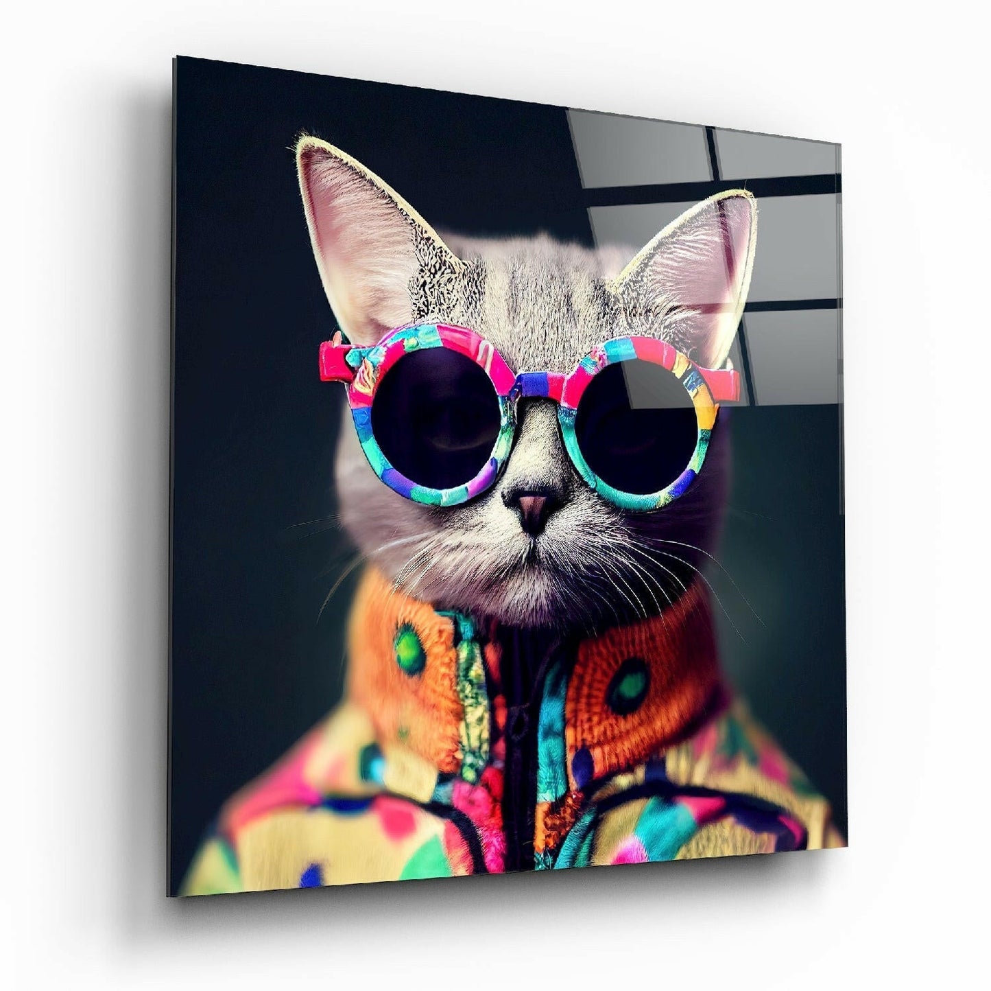 White cat wearing rainbow-framed sunglasses and colorful patterned jacket against dark background on glass wall art.