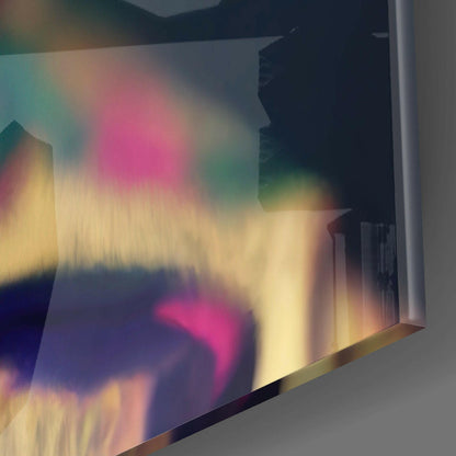 Close-up of iridescent holographic glass panel displaying rainbow gradients of pink, yellow, green, and blue against dark background.