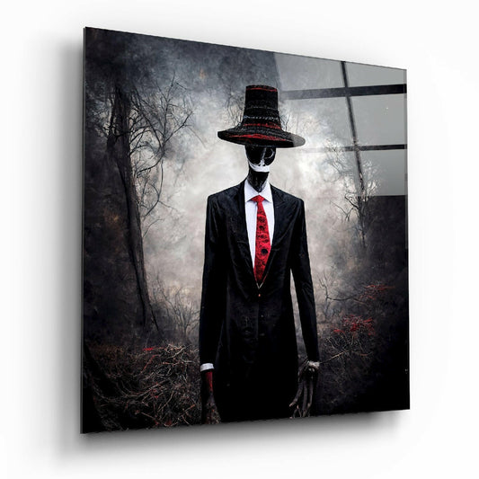 Glass wall art mounted at an angle showing a faceless figure in a black suit and red tie against a dark, bare forest background.