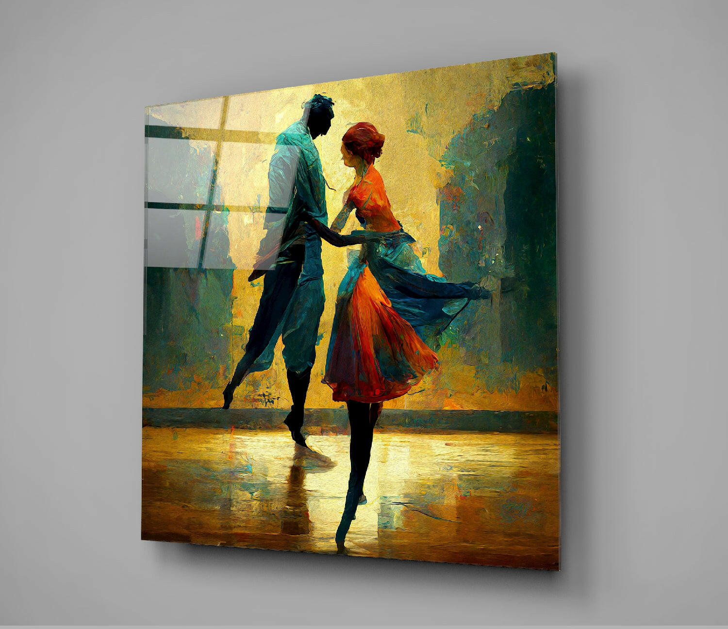 Glass wall art panel displaying two silhouetted dancers in vibrant orange and teal against a weathered yellow-green textured background, mounted on gray wall.