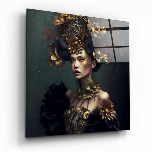 Angled view of glass wall art depicting a woman with gold ornate headdress and black feathered shoulders against dark teal background.