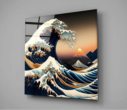 Mounted glass wall art displaying Japanese-inspired wave design with orange sunset, snow-capped volcano, and deep blue water against gray wall.