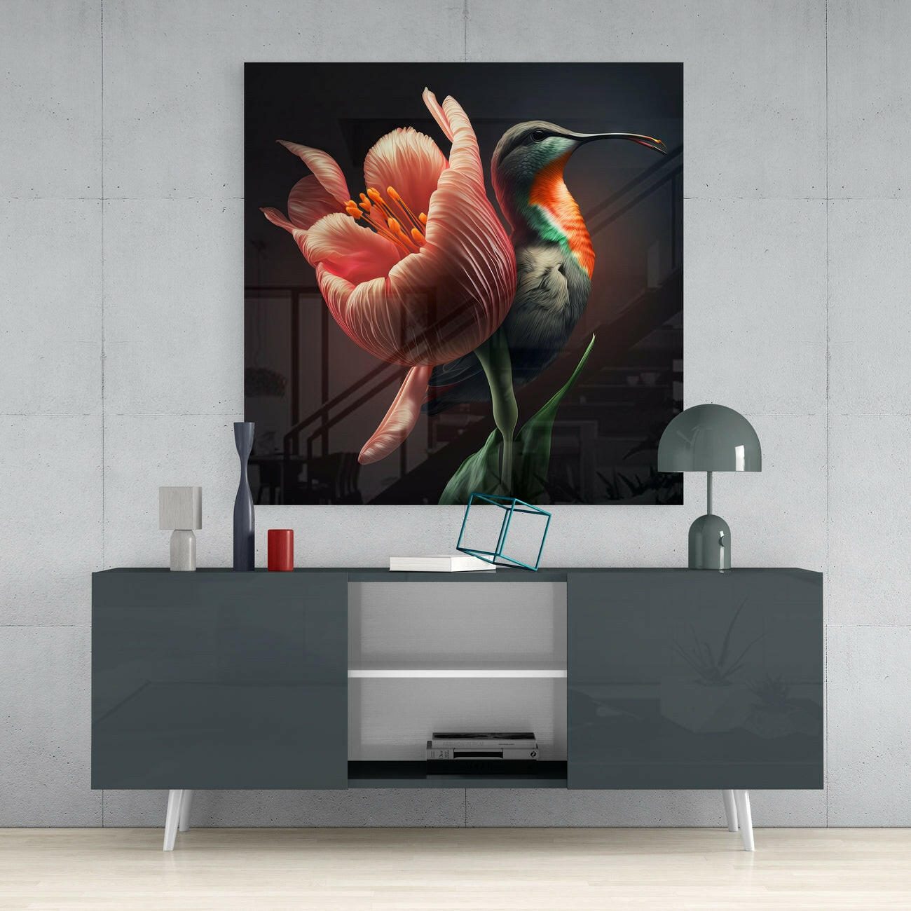 Square glass wall art featuring a red parrot perched on a coral tulip against dark background, displayed above gray media console.