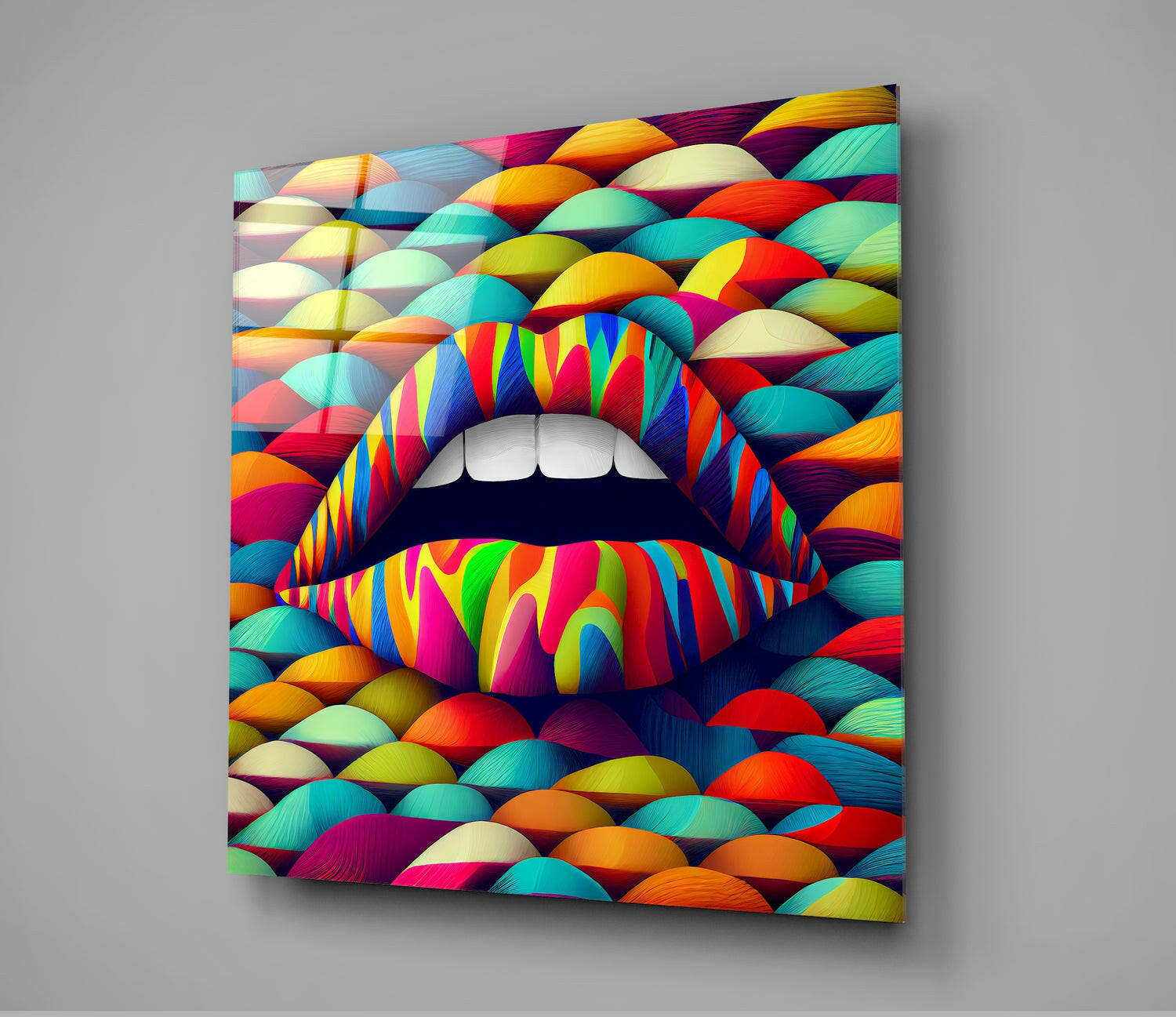Colorful glass wall art depicting vibrant multicolored lips with white teeth against a dynamic rainbow-patterned background, displayed at an angle.