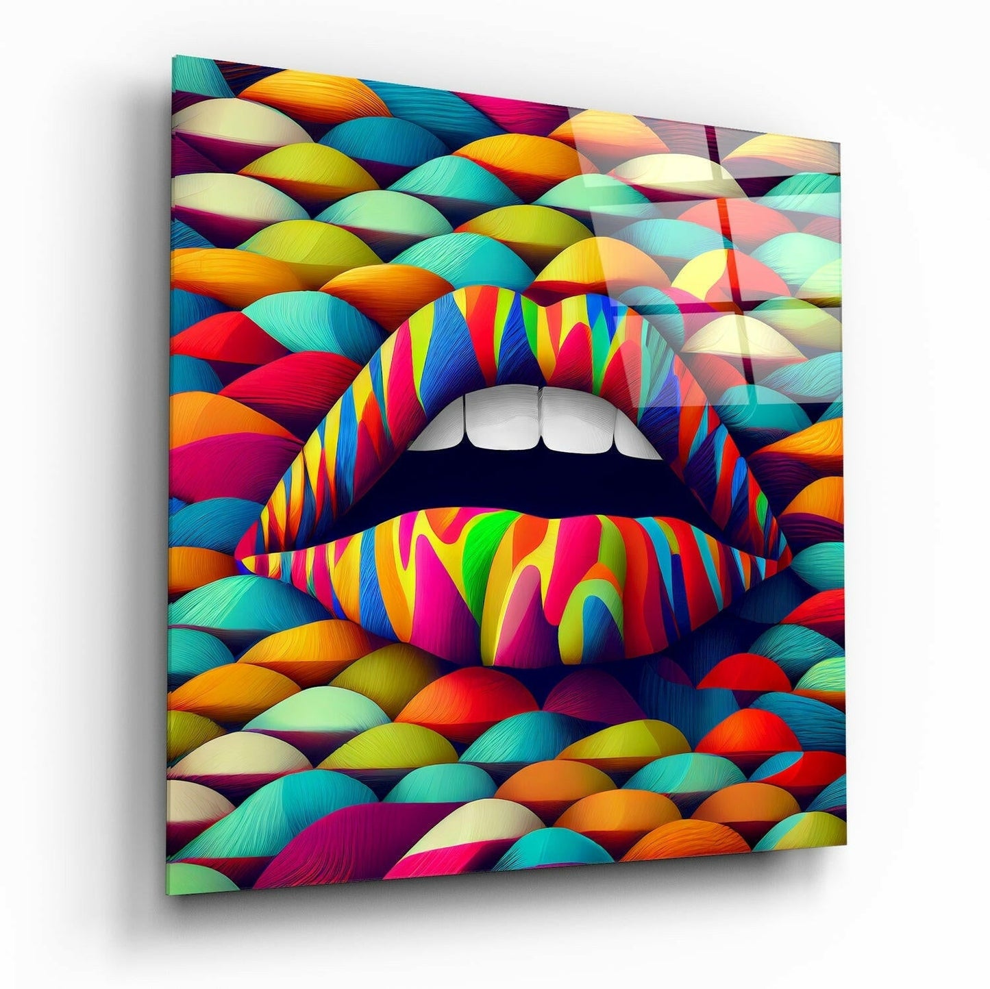 Colorful glass wall art featuring vibrant striped lips with white teeth centered against a multi-colored layered background pattern, displayed at an angled perspective.