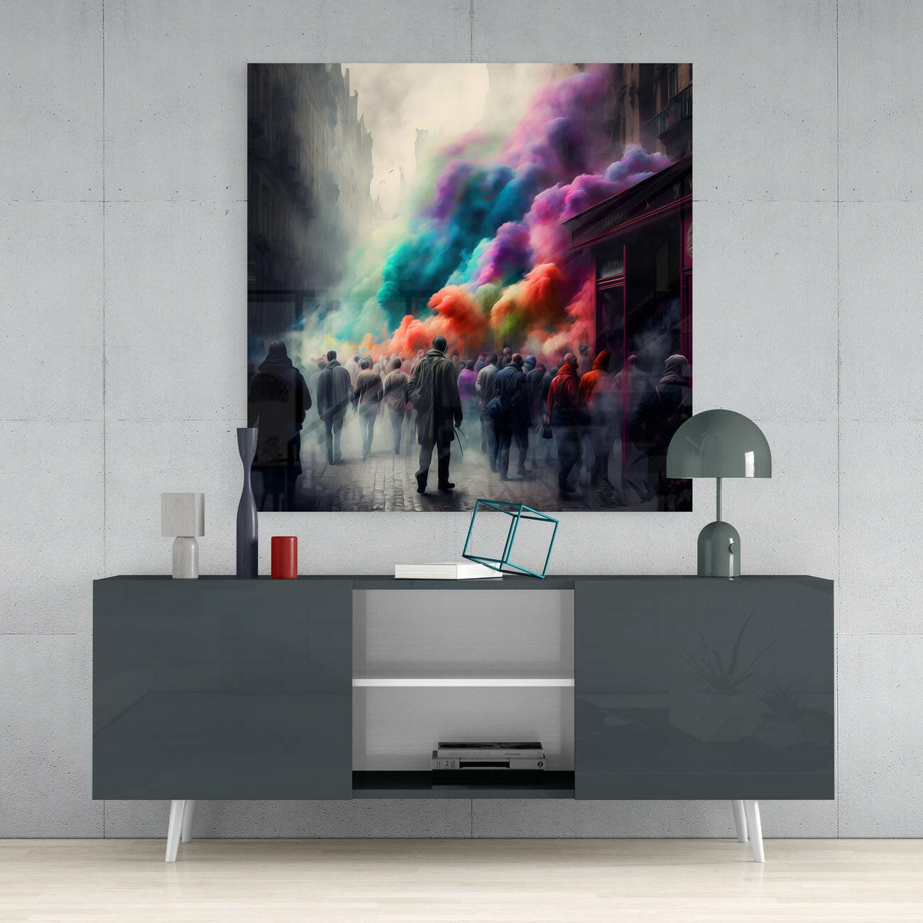 Glass wall art depicting an urban street scene with figures silhouetted against vibrant rainbow-colored powder clouds, mounted above a gray media console.