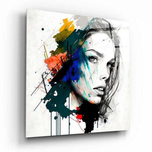 Canvas wall art displaying a woman's face in profile with colorful paint splatters in yellow, orange, blue, and teal overlaying black and white sketch details.