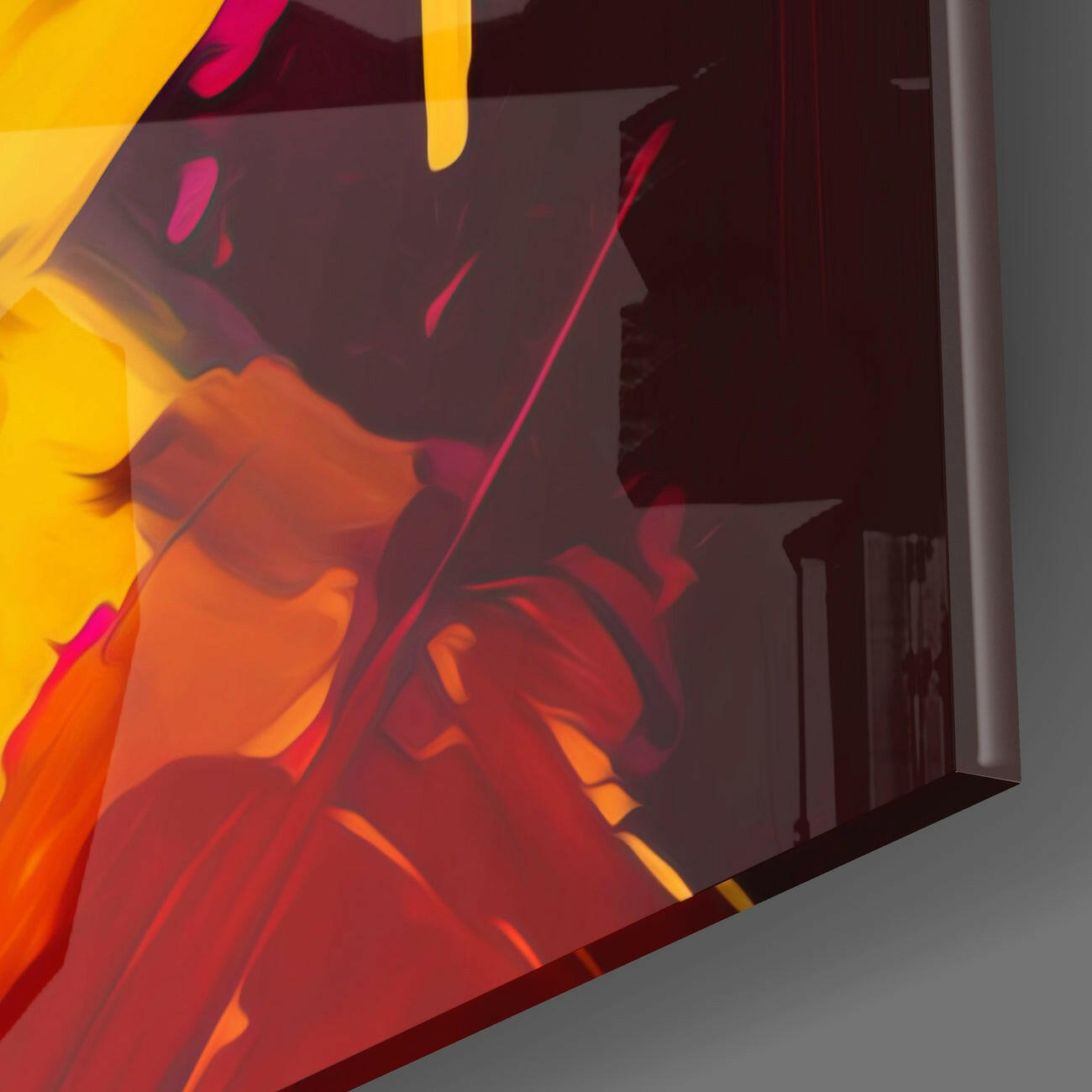 Close-up angled view of colorful glass wall art featuring red, orange, and yellow gradient with silhouetted profile against dark background.