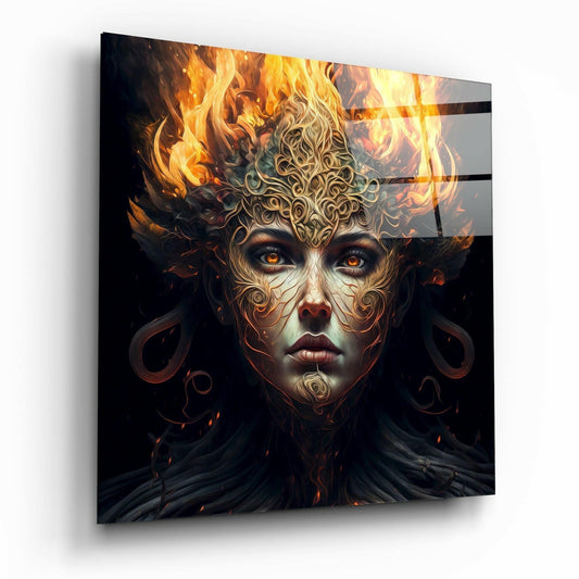 Angled perspective view of glass wall art featuring a stylized female face with ornate filigree patterns and glowing orange flames erupting from the crown area against black background.