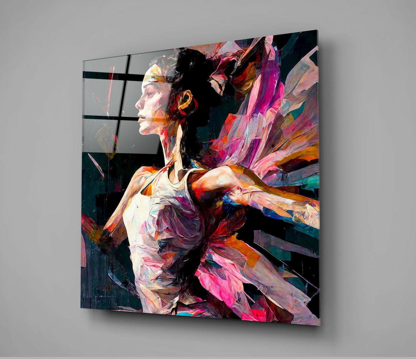 Colorful glass wall art depicting a profile ballerina in vibrant paint strokes of pink, orange, and purple mounted on gray wall.