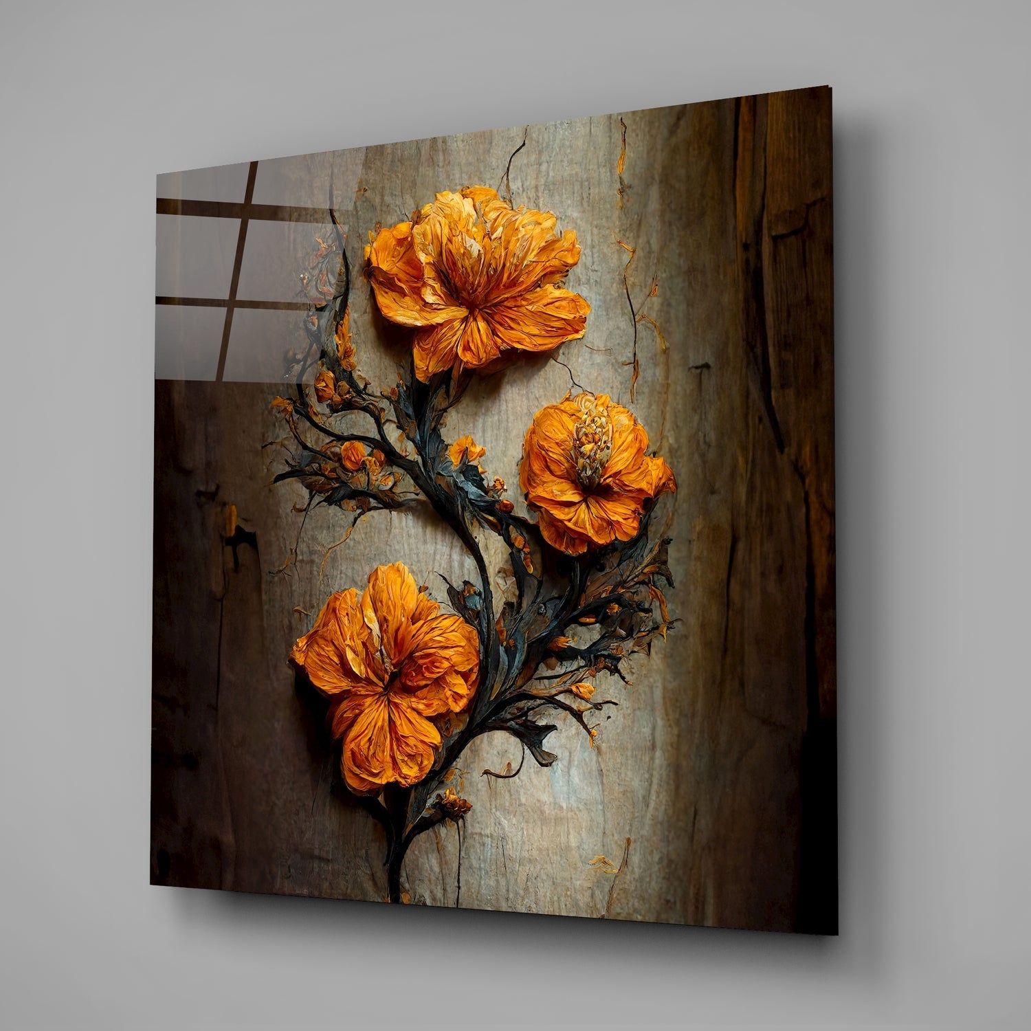 Three vibrant orange flowers on a dark twisted branch against a weathered gray textured wall, displayed as angled glass wall art.