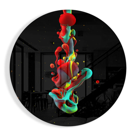 Circular glass wall art featuring a vibrant red, teal, and yellow liquid ink splash design suspended vertically against a dark interior background.
