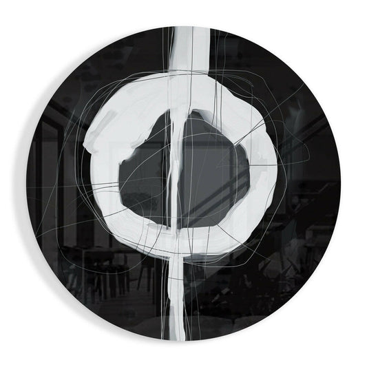 Circular glass wall art featuring a black outer ring with white concentric circles and intersecting geometric lines in the center.