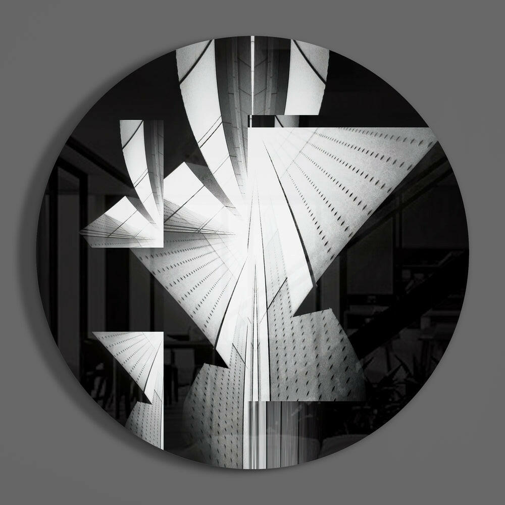 Black and white circular glass wall art featuring upward-looking architectural photograph of modern skyscrapers converging toward sky.