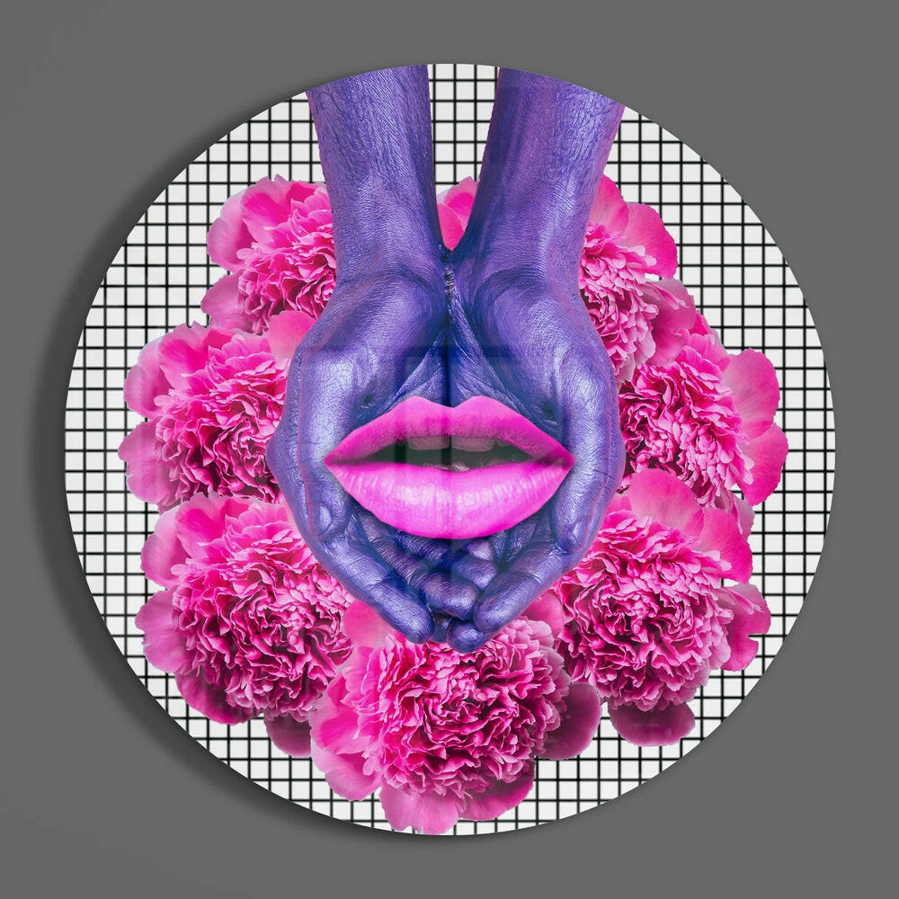 Purple hands forming heart shape around bright pink lips with pink carnation flowers on white grid background circular glass art.