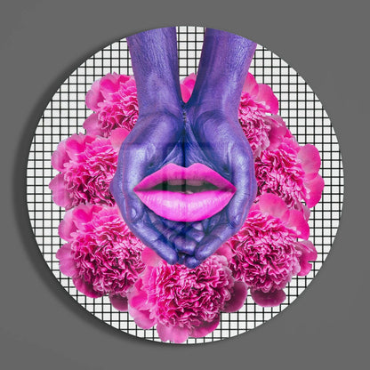 Purple hands forming heart shape around bright pink lips with pink carnation flowers on white grid background circular glass art.