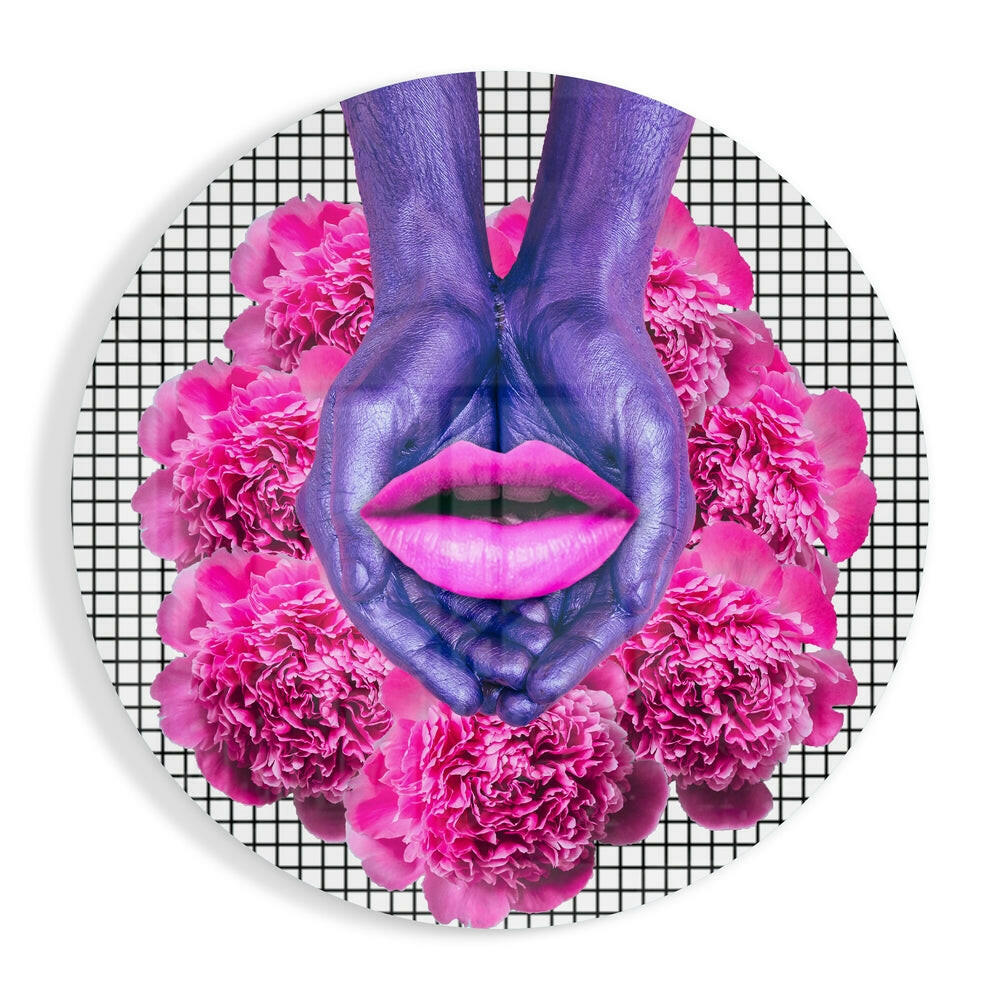 Purple painted hands forming heart shape with bright pink lips and magenta peonies on gridded background circular glass art.