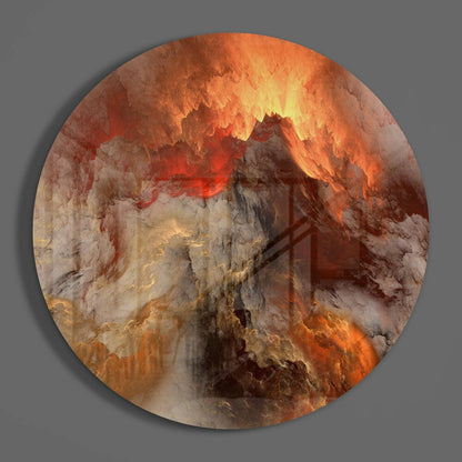 Circular glass wall art featuring swirling orange, red, cream, and brown tones resembling molten lava and volcanic formations against gray background.