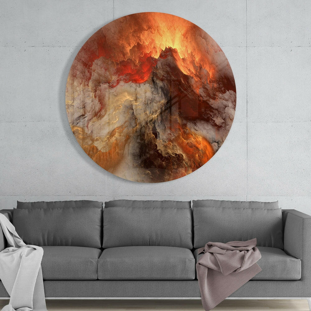 Circular lava glass wall art in orange, red, and cream tones mounted above a gray sofa in a modern interior setting.