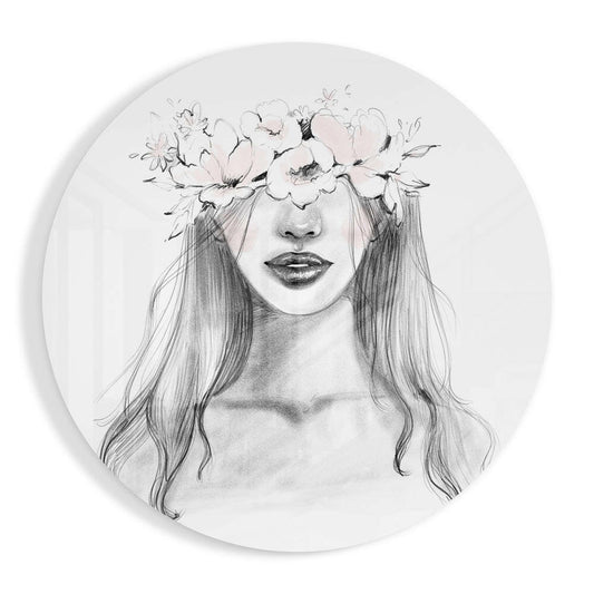 Circular glass wall art displaying a pencil sketch of a woman with long hair wearing a delicate floral crown.