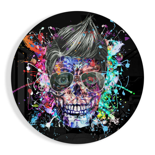 Circular glass wall art featuring a colorful pop art skull with pompadour hair, glasses, and vibrant paint splatters on black background.