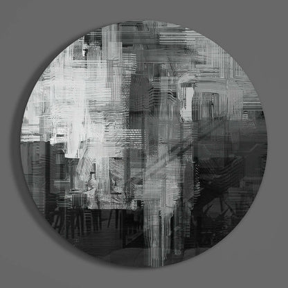 Circular glass wall art featuring abstract linear patterns in white and dark gray tones on neutral background, displayed front-facing.