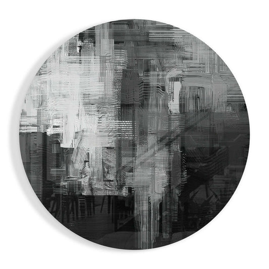 Circular glass wall art with layered black, white, and gray vertical striations creating an abstract textured pattern against white background.