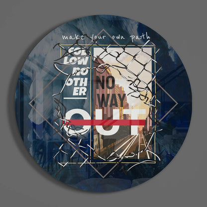Circular glass wall art with blue brushstroke background, geometric gold frames, railway scene, and white text reading "make your own path" and "no way out.