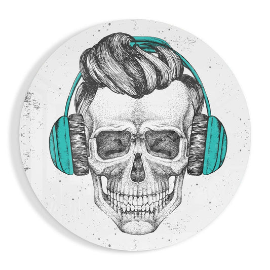 Detailed illustration of a skull wearing teal headphones and sunglasses on a speckled white circular glass panel.