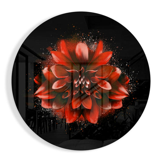 Red dahlia flower with golden particle effects on black circular glass, viewed straight-on against white background.