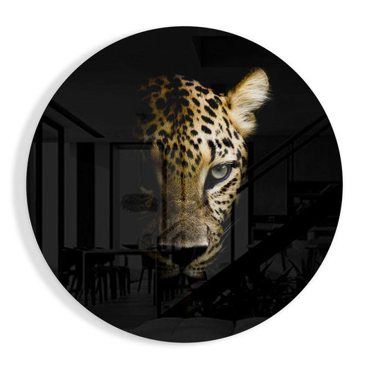 Circular glass wall art featuring a leopard's head in profile, illuminated on one side with golden and white fur against a dark interior background.